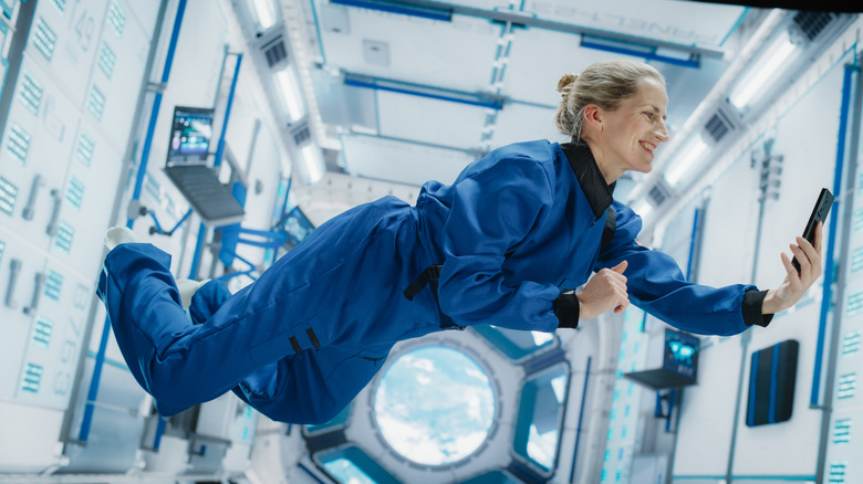 astronaut taking selfie in zero gravity