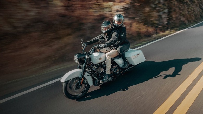 two people riding motorcycle