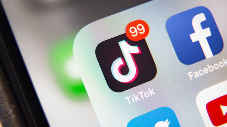 Tiktok app on phone with 99 notifications