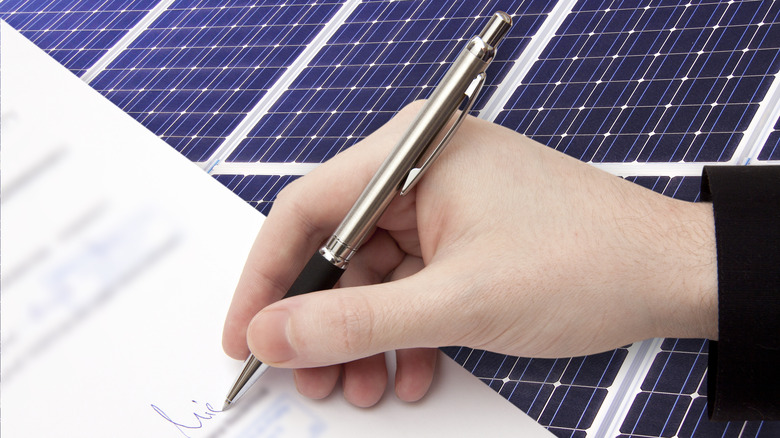 Signing contract solar panels