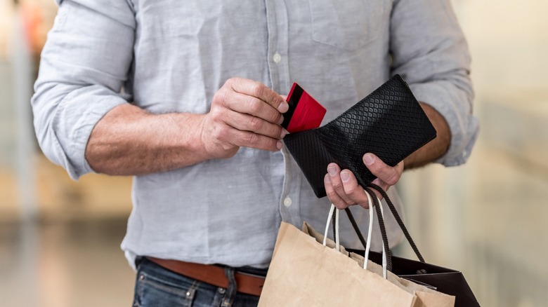 Man shopping with wallet