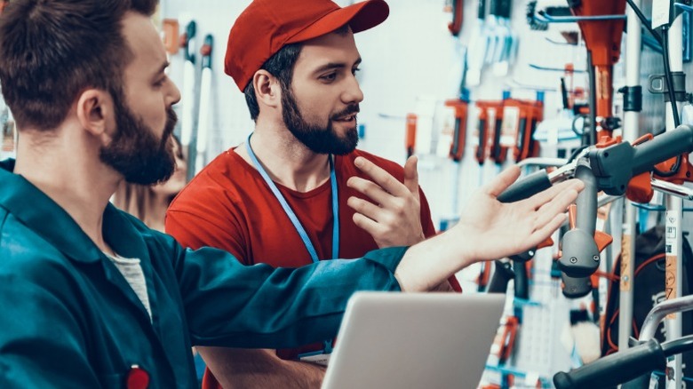 worker and customer with tools