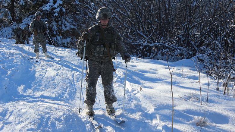 Pair of soldiers training on snow skiis