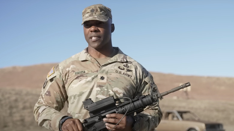 Col. Sauda holding smart shooter M4 rifle