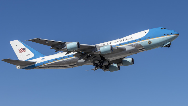 Air Force One taking off against a clear blue sky