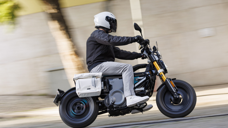 Person riding the BMW CE 02 electric motorcycle