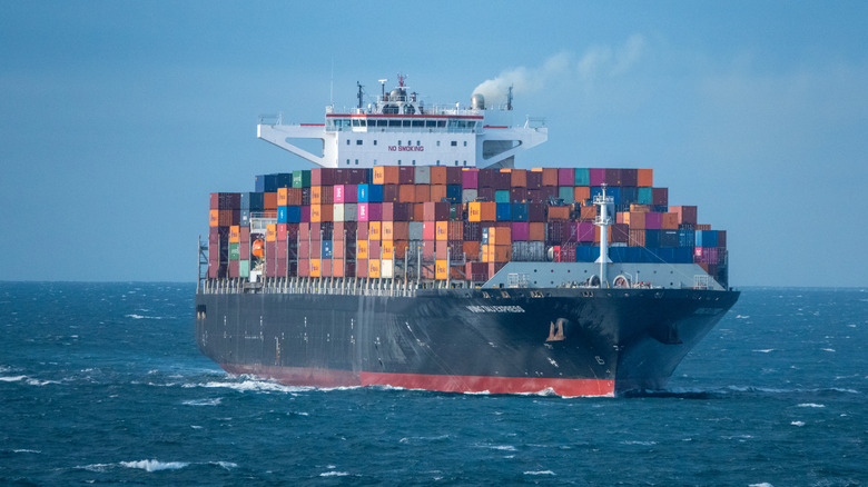 A Container Ship Loaded With Cargo On Calm Waters