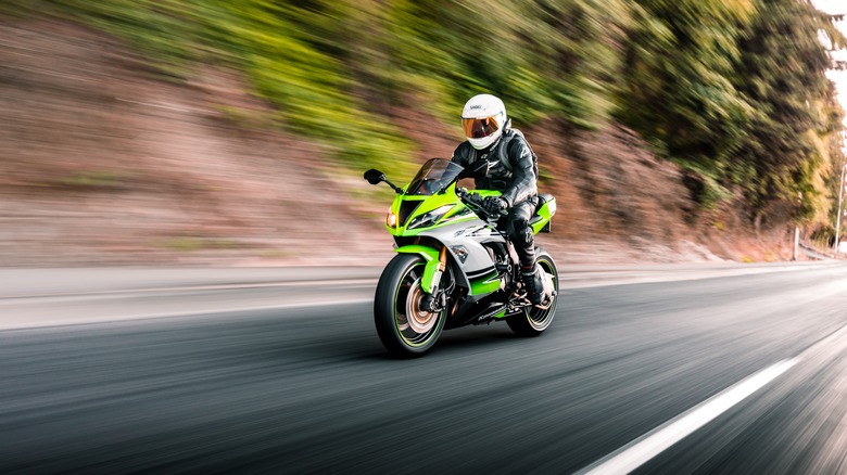 Guy riding a Kawasaki Ninja