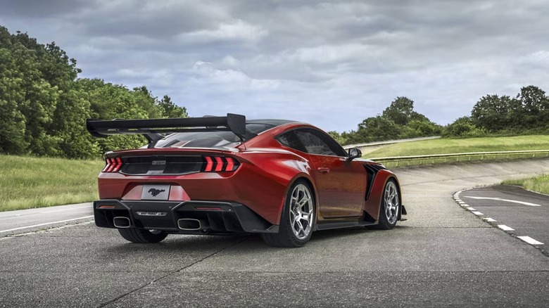 Rear angle view of a red 2025 Ford Mustang GTD on a racetrack