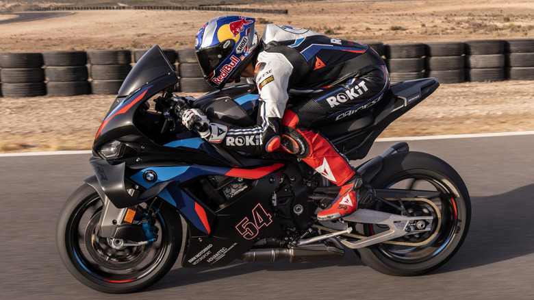 A racer speeds down a desert track atop a new Blackstorm Metallic M1000RR
