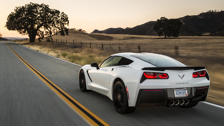 2014 Chevrolet Corvette Stingray driving down a two-lane highway