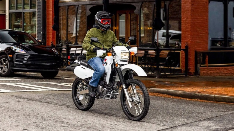 Riding a Honda XR650L Dual Sport motorcycle on the street.