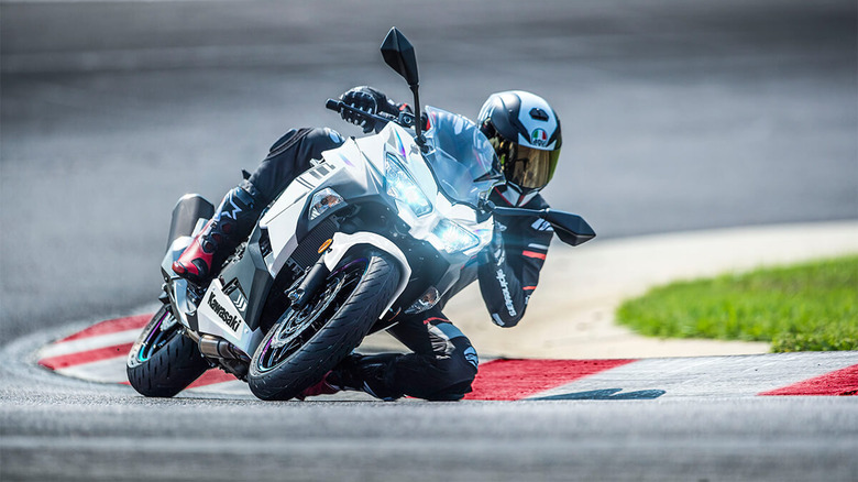 racer turning on white motorcycle