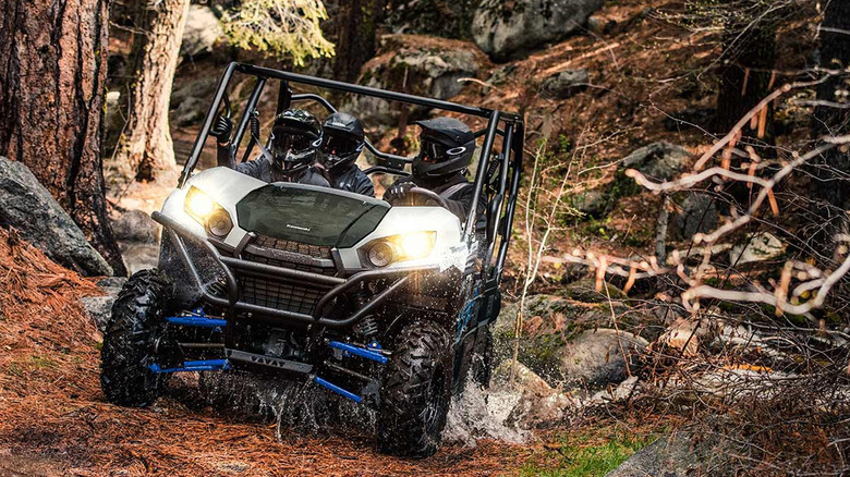 People riding in Kawasaki Teryx 4