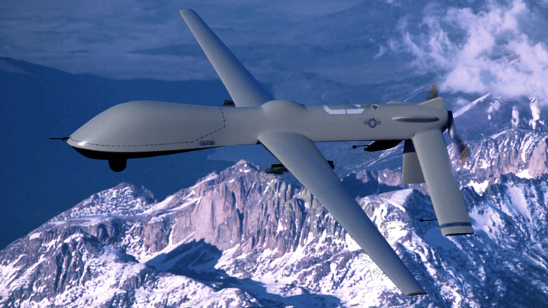 MQ-1 Predator flying over mountains