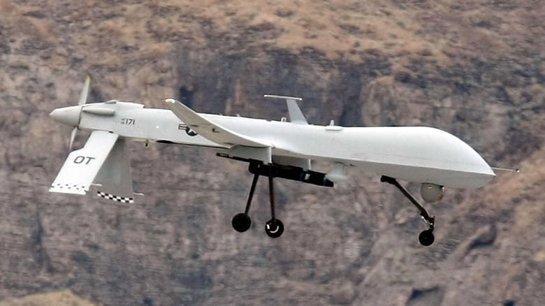 MQ-1 Predator flying over mountains