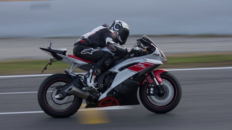 Man riding Yamaha R6 on track