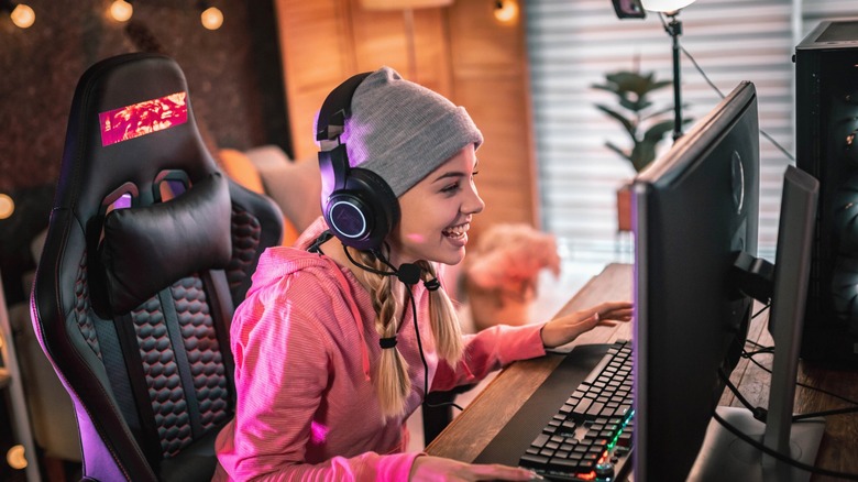 girl playing games on computer