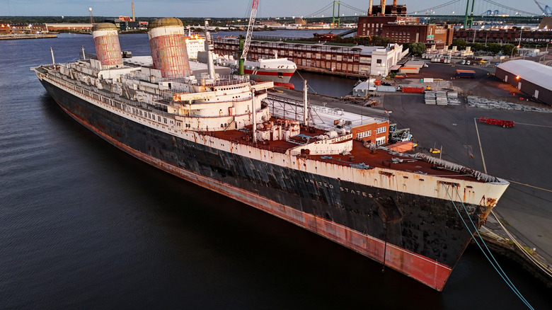 The SS United States sitting at a pier in Philadelphia, waiting to be turned into a reef.