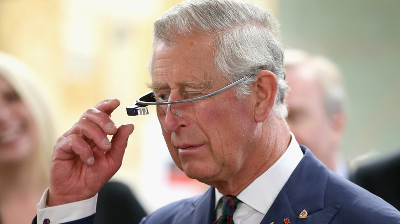 Prince Charles, Prince of Wales tries on 'Google Glass' spectacles