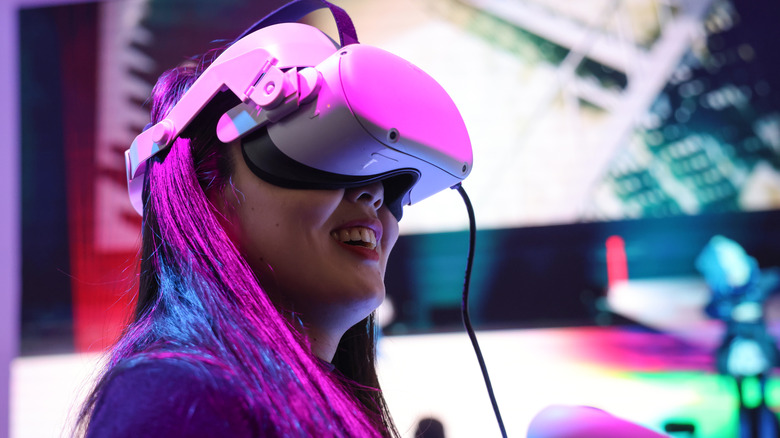 An attendee wears a Meta Platforms Inc. Oculus Quest 2 virtual reality (VR) headset