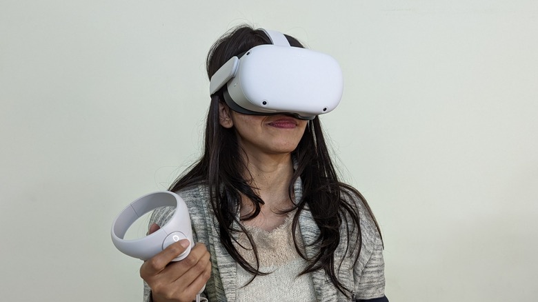 A woman wearing a Meta Quest headset