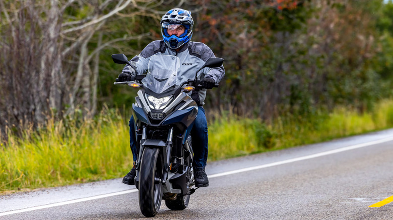 riding Honda NC750X on road