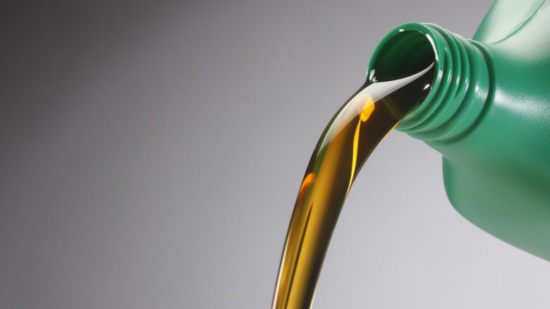 Motor oil pouring from bottle