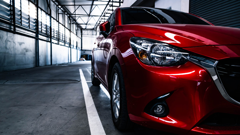 Red car parked in garage