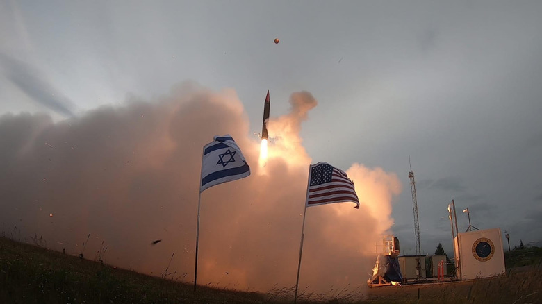 Missile launch next to flags