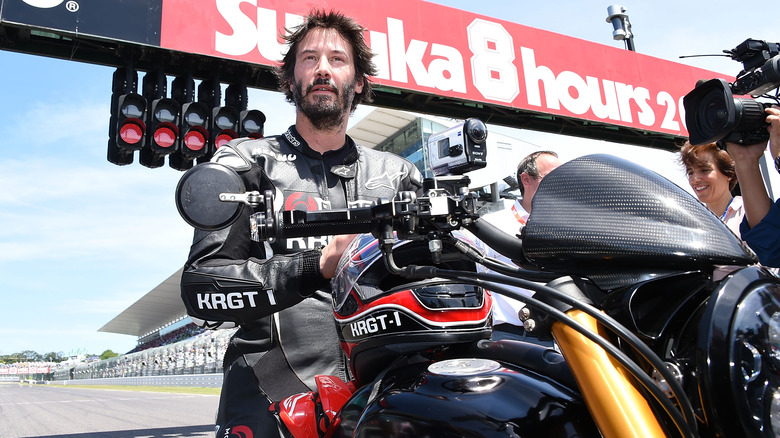 Keanu Reeves on motorcycle on racetrack 