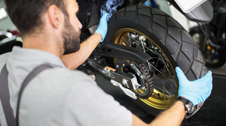 Mechanic replacing motorcyle tire