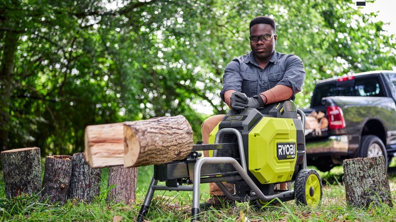 Ryobi battery-operated log splitter splitting a log