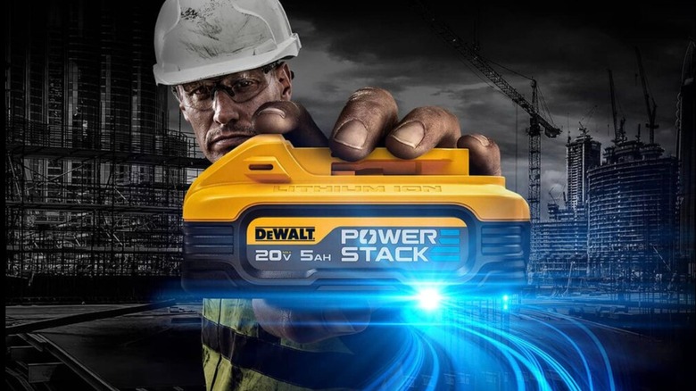 Worker holding a 20V 5 Ah DeWalt PowerStack battery