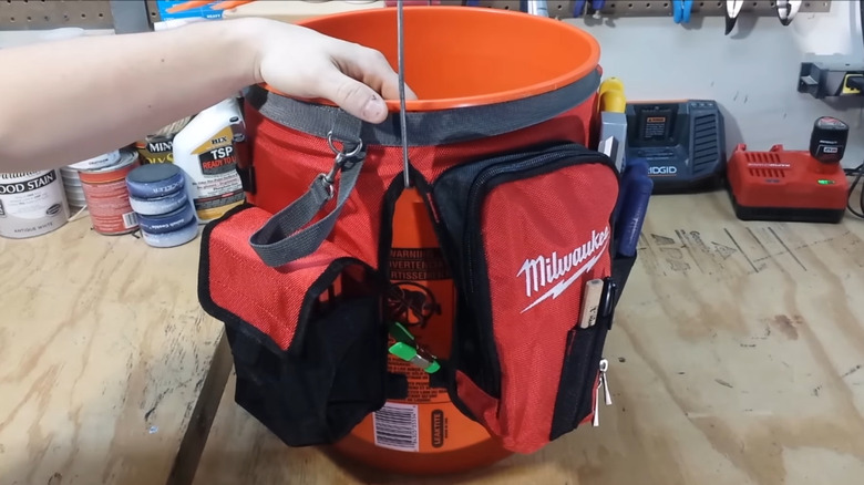 Bucket with bucket organizer on table