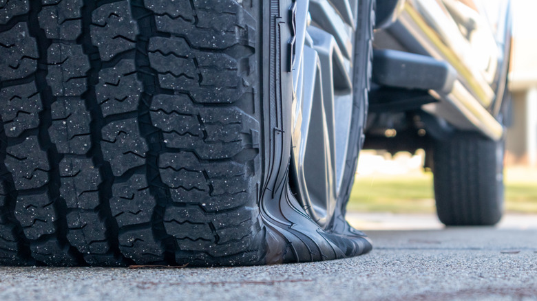 Close-up of a flat truck tire on a truck