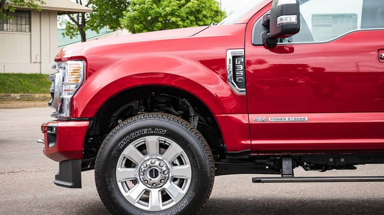 Red Ford F-350 6.7 Power Stroke diesel parked in driveway