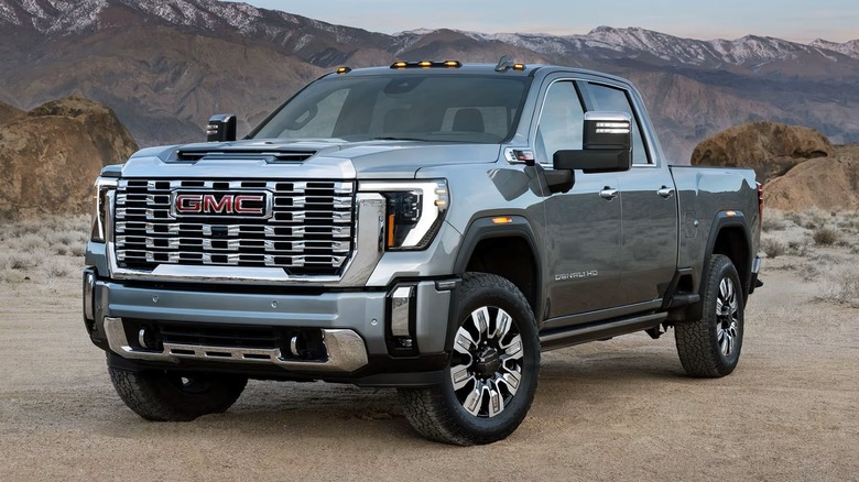 2025 GMC Sierra truck parked off-road with mountains in the background