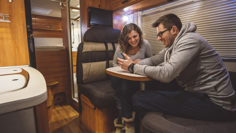 Couple using electricity in their RV