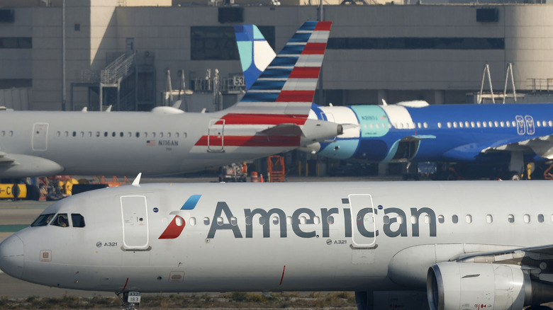 An American Airlines jet taxiing on runway