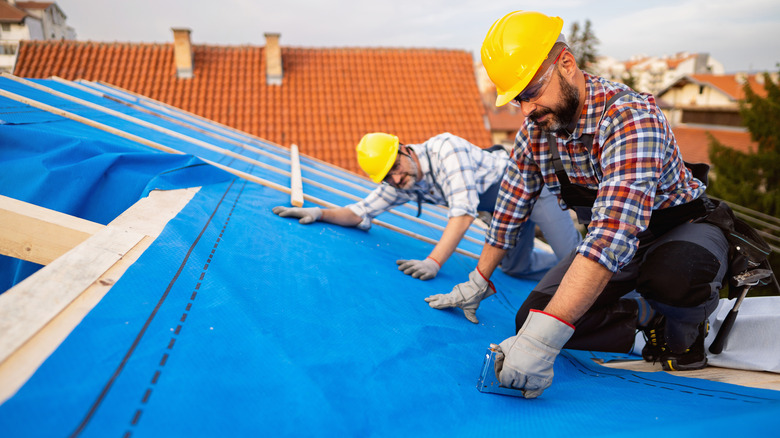 roofers working on a roof