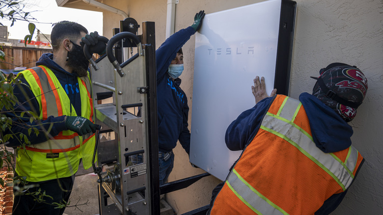 Contractors installing powerwall