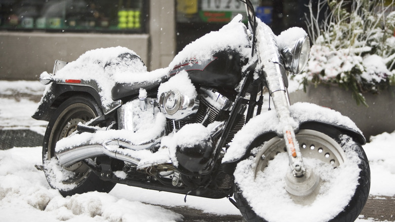 A motorcycle covered in snow.