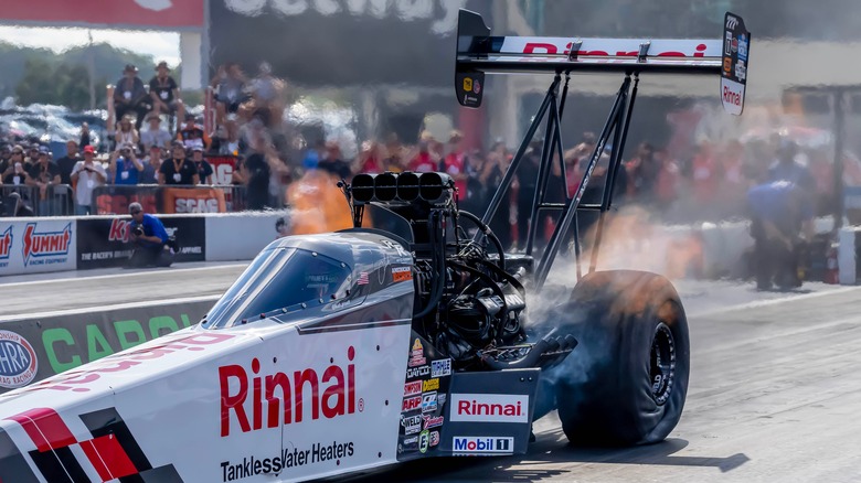 Top fuel dragster on drag strip