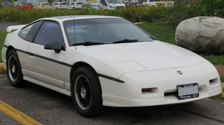 White 1988 Pontiac Fiero GT in parking lot