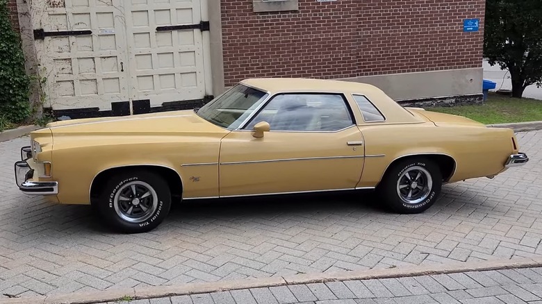 gold 1973 pontiac grand prix