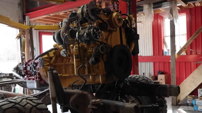 A yellow Cat engine being fixed