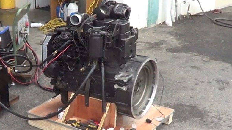 A Cummins 3.9L 4BT crate engine set up to start on a stand.