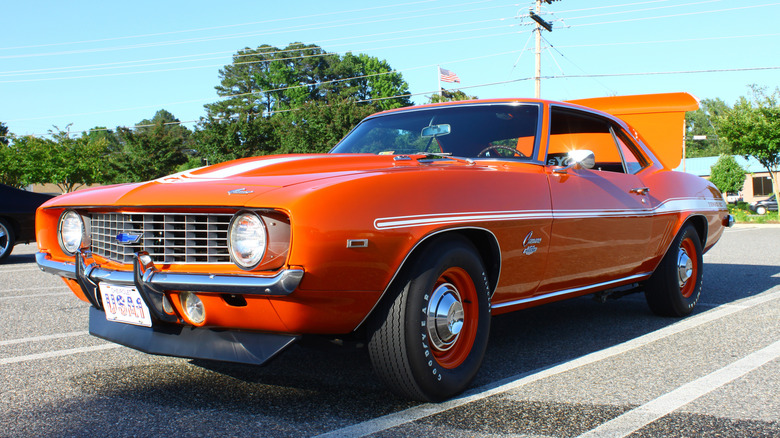 Front 3/4 view of an orange1969 Yenko Camaro