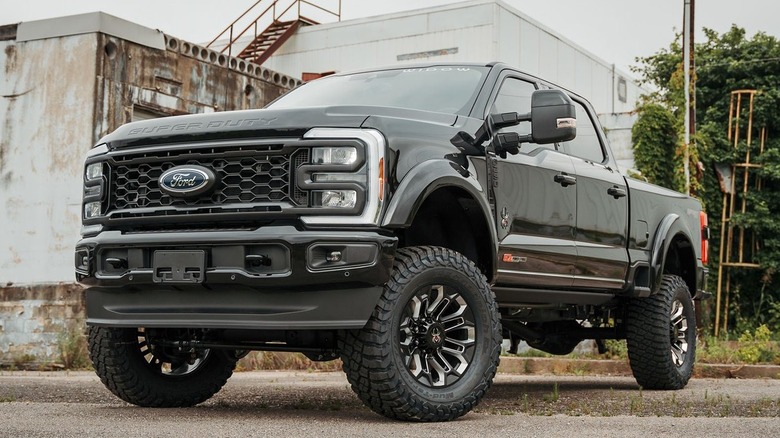 Ford F-250 parked in front of old industrial building